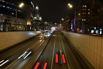 Naklejka na ściany i meble evening busy traffic on highways in a metropolis