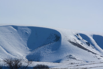 Obraz premium Mountains of Kazakhstan. The road to the snow mountain.