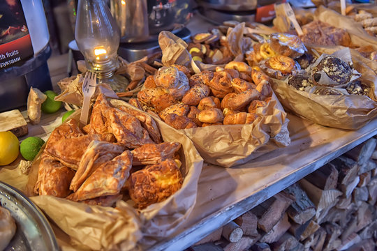 Cakes and other pastries in a cafe in baskets