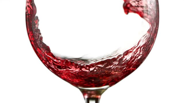 Super Slow Motion Detail Shot of Pouring Red Wine Isolated on White Background at 1000fps. Filmed with High Speed Cinema Camera at 1000fps