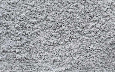 Gray plastered wall, patterned background, indented protruding texture 
