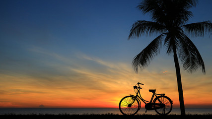 silhouette vintage bike on sunrise