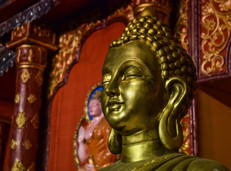 Fototapeta premium Face of a golden buddha statue