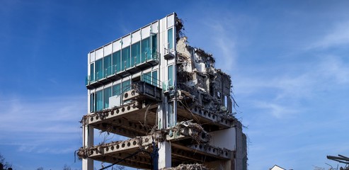 modern looking building being demolished