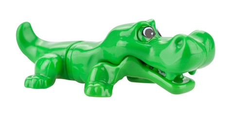 Plastic crocodile toy isolated on white background.