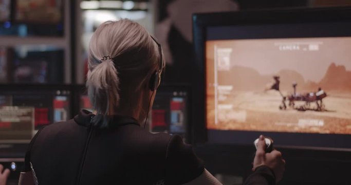 Woman controlling Mars rover with remote controller