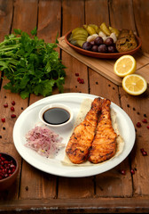 fried salmon with side onion and sauce