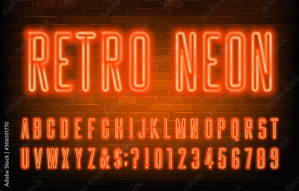 Fototapete retro neon alphabet font. condensed orange neon letters and numbers. brick wall background. stock ve