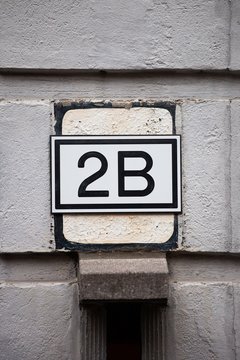 number 2b on white wall