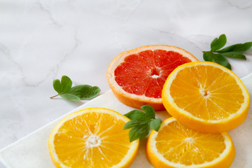Fresh oranges wallpaper. Healthy fruits - oranges and grapefruits. Brights healthy food on a marble table