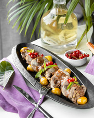 meat pieces with pickles and berries