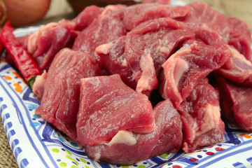 raw lamb meat on a wooden table