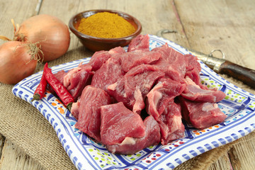 raw lamb meat on a wooden table