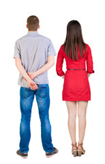Back view of couple. beautiful friendly girl and guy together.
