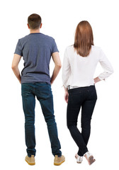 Back view of couple. beautiful friendly girl and guy together.