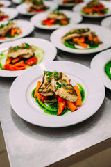 Cooking a delicious main course in the restaurant kitchen. Catering on holiday.