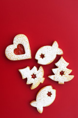 Fototapeta premium Homemade linzer cookies filled with red jam and dusted with powdered sugar