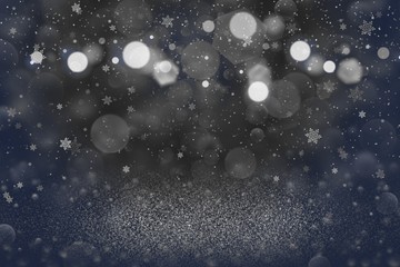 Fototapeta na wymiar blue beautiful sparkling glitter lights defocused bokeh abstract background with falling snow flakes fly, festive mockup texture with blank space for your content