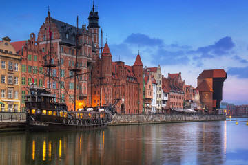 Fototapeta premium Gdansk with beautiful old town over Motlawa river at sunrise, Poland.