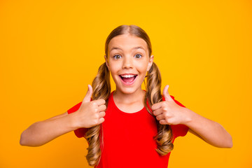 Closeup photo of pretty little lady raising both thumb fingers expressing agreement approving...