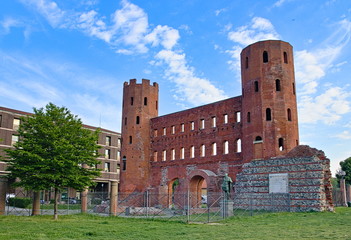 View on the Porte Palatine, ancient gateway to the Roman city of Augusta Taurinorum, in a bright...
