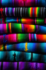 Typical Guatemalan fabrics, stacked colorful handmade fabrics - Antigua Guatemala