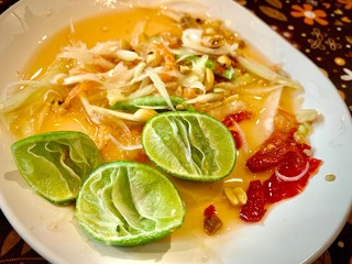 Faded squeezed lime, ingredients in papaya salad, Remaining peels of lemon after squeezing, top view of fresh lemons on wooden table, Food ingredient concept, Residue of food background