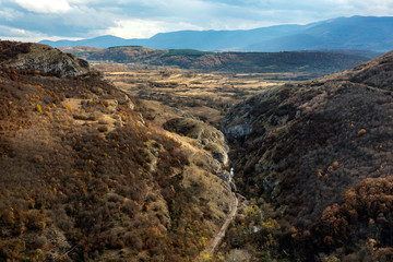Autumn mountain view with old railway with its tunnels and a river passing through the canyon, Southern Serbia