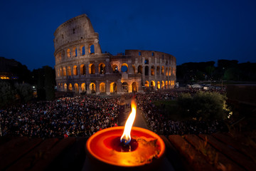 Plakat Rome - Italy, April 19, 2019: Pope Francis leads the Via Crucis (Way of the Cross) torchlight procession at the Colosseum on Good Friday..