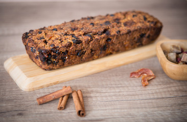 Homemade fruit bread with cosy winter decorations