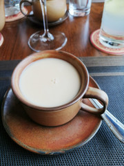 Fototapeta na wymiar Milk tea with bubbles in brown ceramic cup