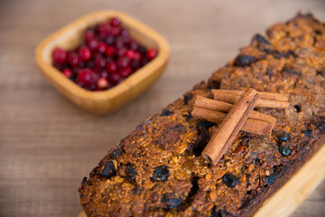 Homemade fruit bread with cosy winter decorations