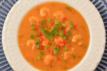 shrimp moqueca with chives, parsley and pepper