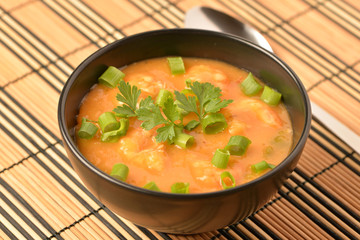 shrimp moqueca with chives, parsley and pepper