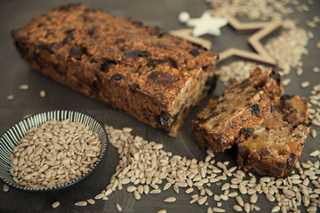 Homemade fruit bread with cosy winter decorations