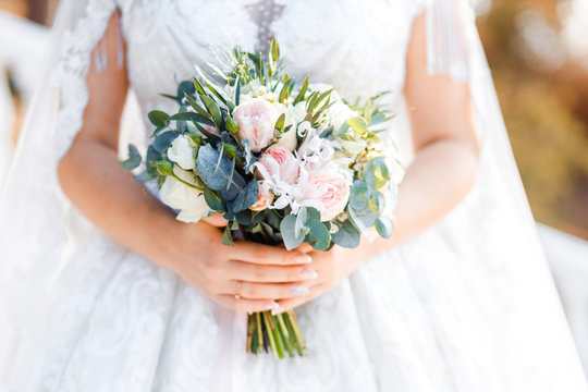 Delicate classic wedding bouquet of roses for the bride. Wedding flowers.