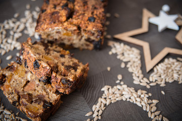 Homemade fruit bread with cosy winter decorations