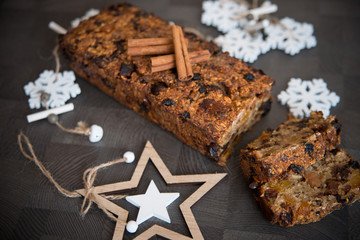Homemade fruit bread with cosy winter decorations
