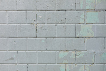 Wall of blue tiles covered with gray paint. Background. Photowall-paper. Copy space.
