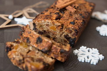Homemade fruit bread with cosy winter decorations