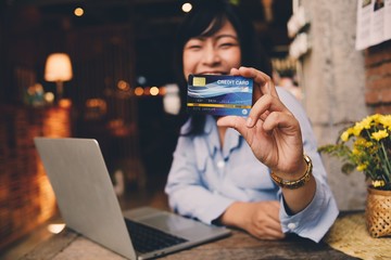man with tablet computer in cafe