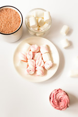 Cup of hot flavored cocoa with marshmallows on a  white background. Christmas composition with cocoa. Cozy home mood.