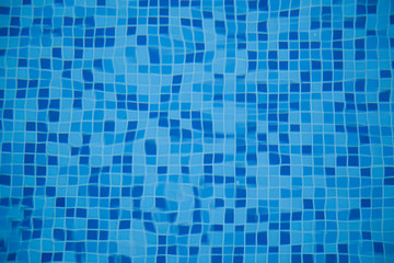 A close-up of sun reflections in pool water