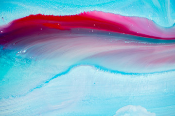 Abstract fluid acrylic painting. Marbled blue abstract background. Liquid marble pattern. Hand painted background with mixed liquid red, blue and green paints. Modern art. 