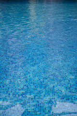 A close-up of sun reflections in pool water