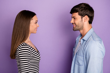 Profile photo of two people couple guy lady standing opposite looking eyes friendly smiling finally meet wear stylish casual outfit isolated pastel purple color background
