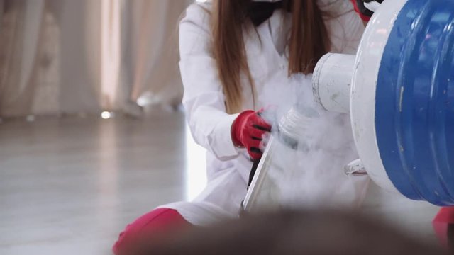 pouring liquid nitrogen into a thermos