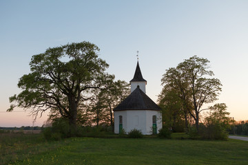 Fototapeta na wymiar White Christian church in countryside. Estonia.