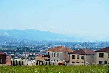 Fototapeta na wymiar landscape village on a background of mountains
