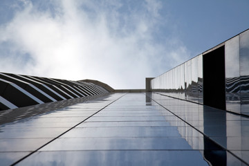 Fototapeta premium Apartment building is reflecting on the glass wall 